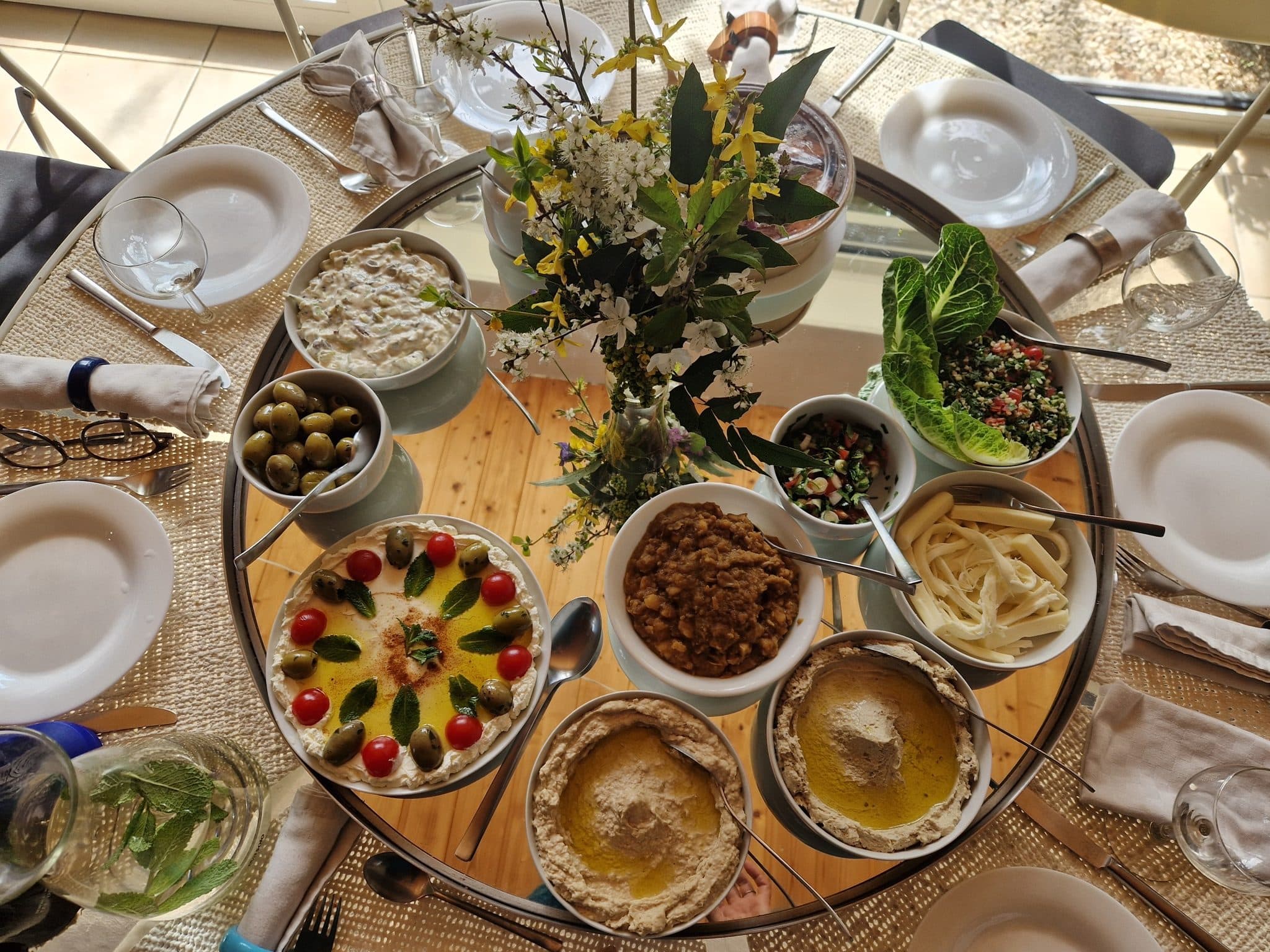 Table of mezze dishes with olives and dips